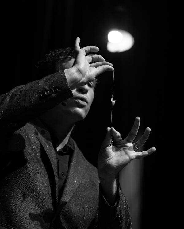 Close-up of Evan's hands during a live magic demonstration, black and white
